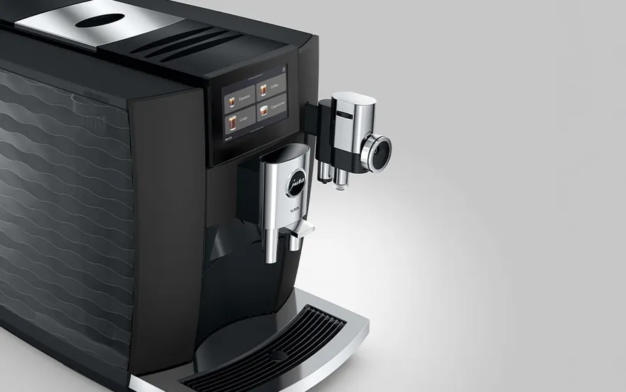JURA S10 seen from above at an angle: touchscreen, spout and the textured side panel