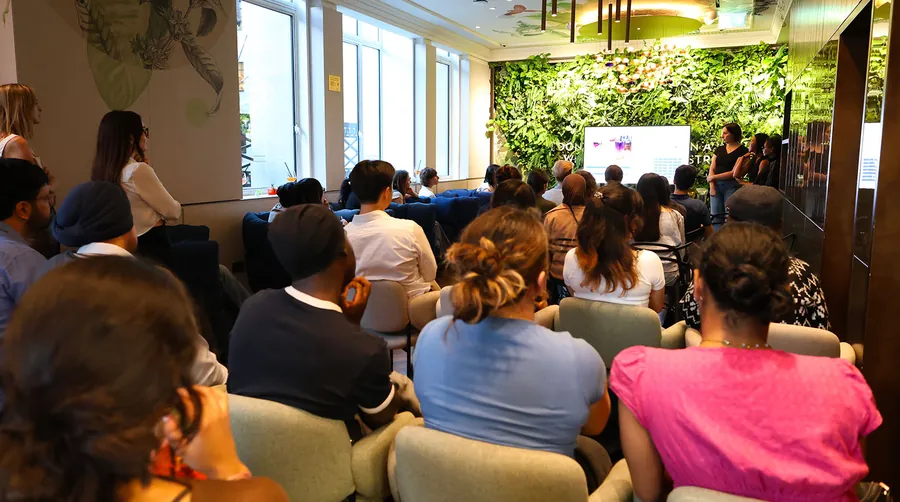 Audience following a presentation at the Lavazza Rainbow Studio hackathon